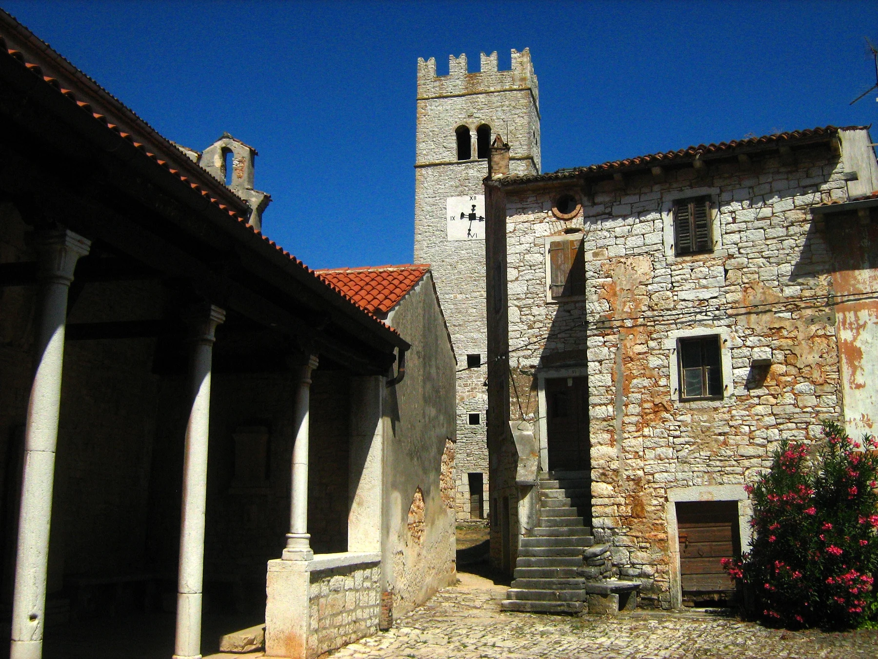 The bell tower and stone square of Sveti Lovreč